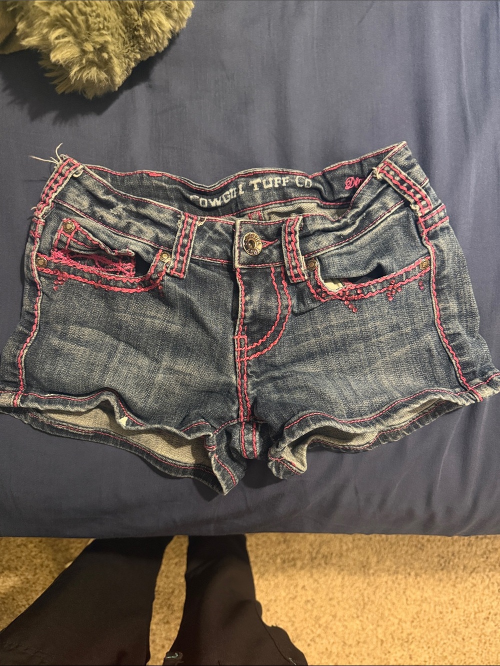Pink-stitched Cowgirl Tough Co shorts
